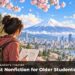 A girl sketching on a hillside overlooking a Japanese city, cherry blossoms and Mount Fuji.